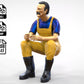 Diorama Modellbau Produktfoto 0: Sitzender Fischer mit Bart – Figur in Ölzeug und Gummistiefeln (Ref. Nr. 443)