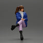 Foto de producto de modelismo para diorama 6: Figura sentada: mujer con las piernas cruzadas, coleta y chaqueta (a161)